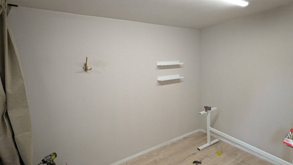 Fully finished garage conversion with wall furnishings added