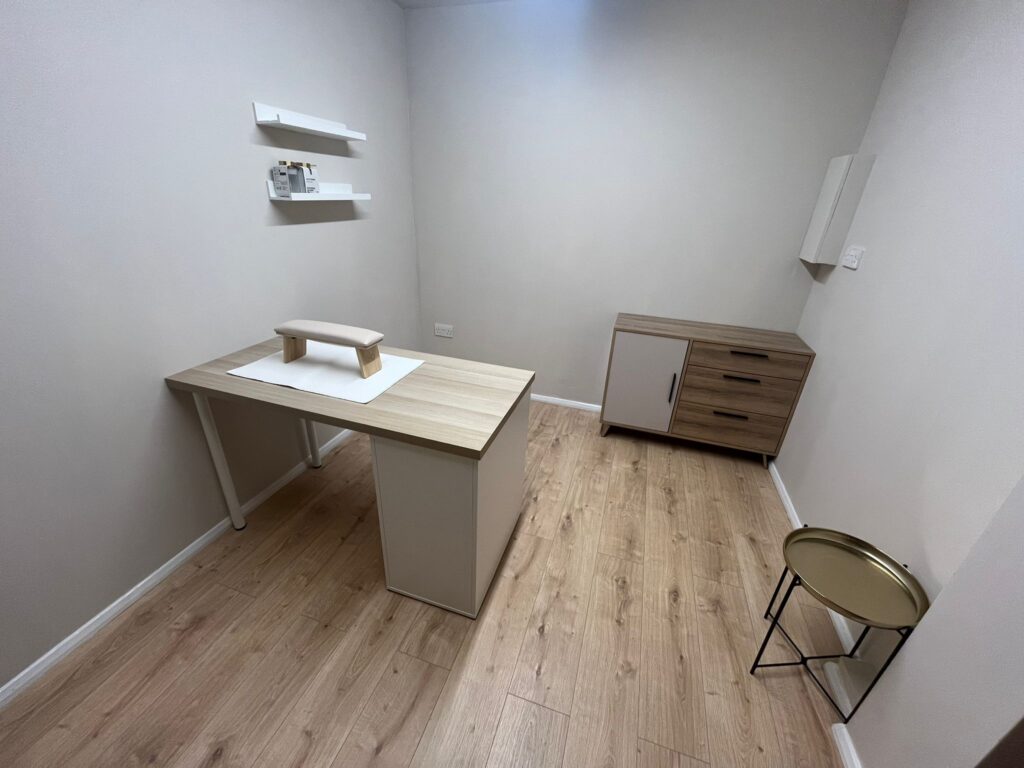 Right view of garage conversion with desk and storage unit