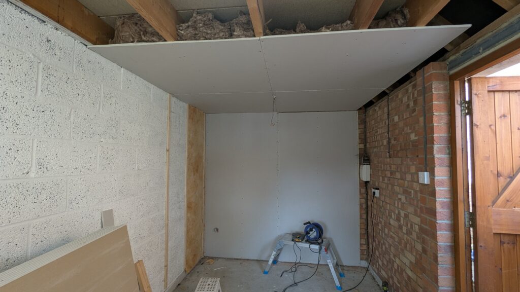installing plasterboard and insulation onto battons