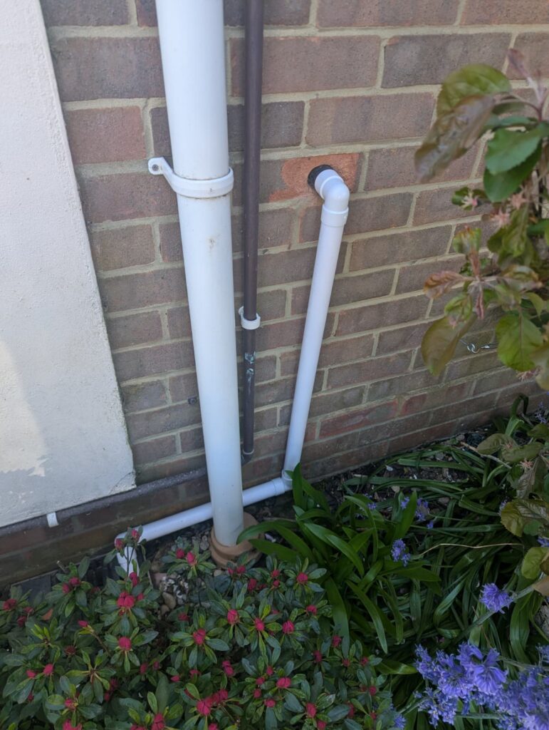 re-routed basin waste in white PVC to match
